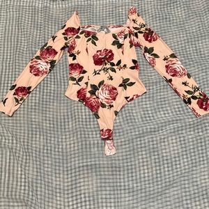 Charlotte Russe floral body suit. Never worn.